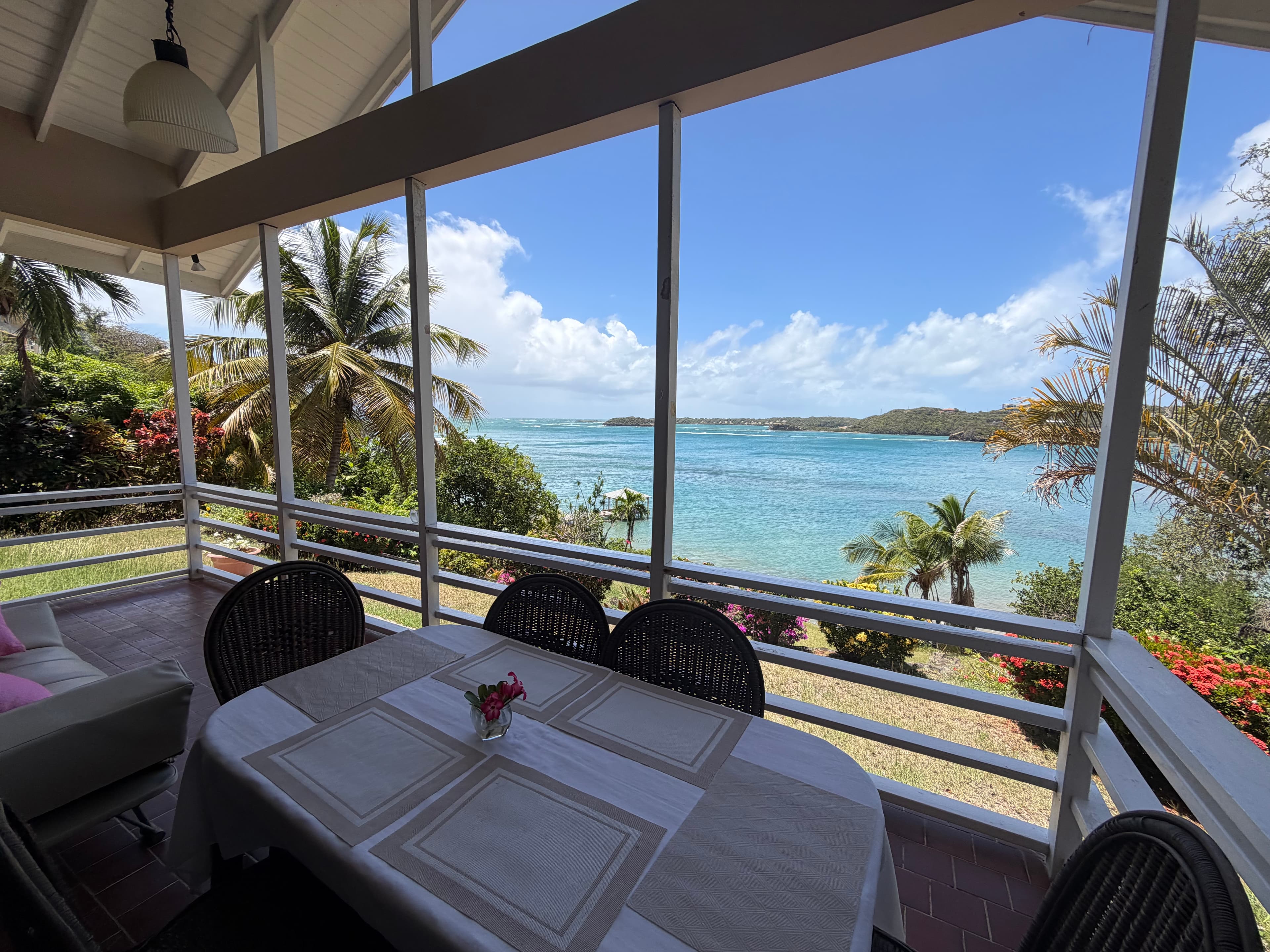 Verandah dining with sea views